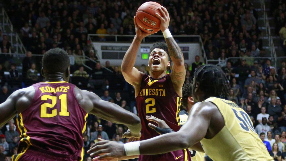 Minnesota guard Nate Mason (2) pulls up for a shot in the lane against Purdue during the first half Sunday.