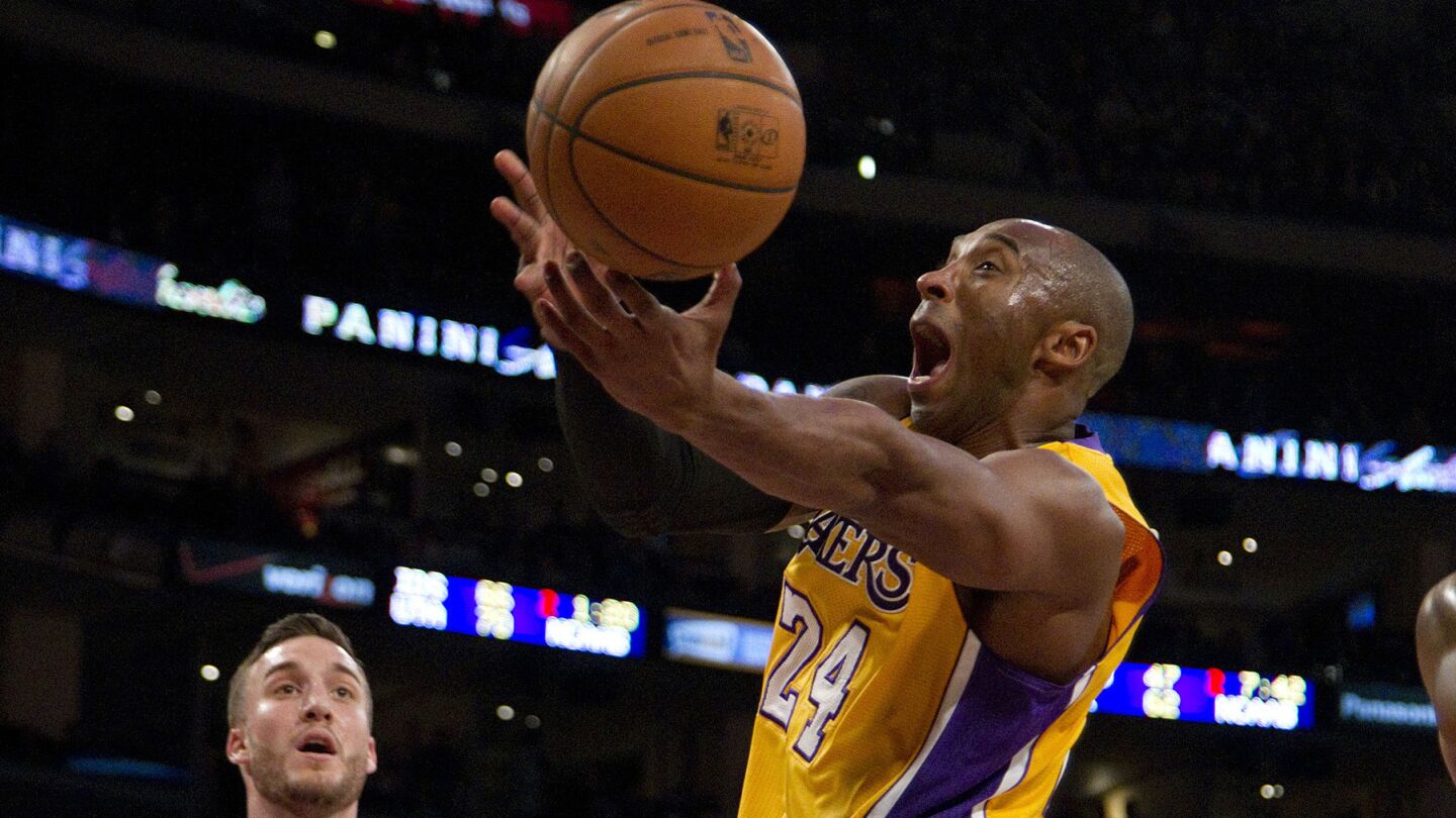 Lakers star Kobe Bryant puts up a shot against the Phoenix Suns at Staples Center on Dec. 10, 2013.