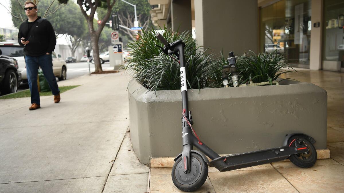 A Bird scooter stands along 5th Ave. in Santa Monica. The start-up company is raising $150 million in a funding round that will give it a $1-billion valuation.