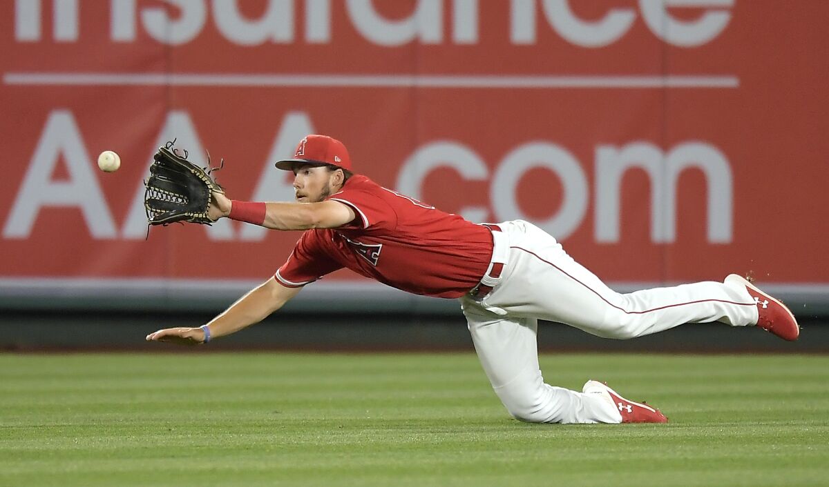 Angels outfield prospect Brandon Marsh makes a catch against the Dodgers in a preseason game March 24, 2019, in Anaheim.