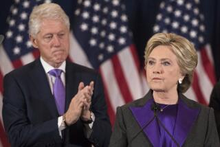 Former President Bill Clinton applauds as his wife, Democratic presidential candidate Hillary Clinton speaks in New York, Wednesday, Nov. 9, 2016, where she conceded her defeat to Republican Donald Trump after the hard-fought presidential election. President Trump and his allies are harking back to his own transition four years ago to make a false argument that his own presidency was denied a fair chance for a clean launch. Press secretary Kayleigh McEnany laid out the case from the White House podium last week and the same idea has been floated by Trump's personal lawyer and his former director of national intelligence. The day after her defeat in 2016, Hillary Clinton conceded. (AP Photo/Matt Rourke)