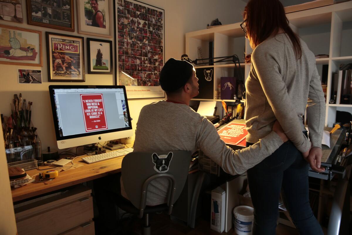 Artist Jason Shelowitz (known at Jay Shells) brought his "Rap Quotes" project from New York to Los Angeles in December 2013. Jason and his wife, Rachel, are seen here at the desk where he designs the signs.