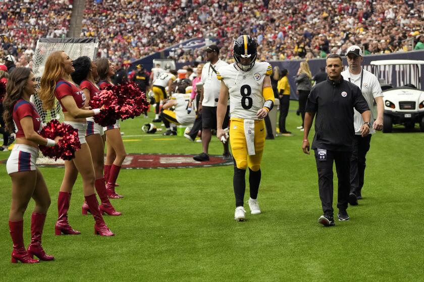 Pittsburgh Steelers quarterback Kenny Pickett (8) leaves the field after an injury during the second half of an NFL football game against the Houston Texans, Sunday, Oct. 1, 2023, in Houston. (AP Photo/David J. Phillip)