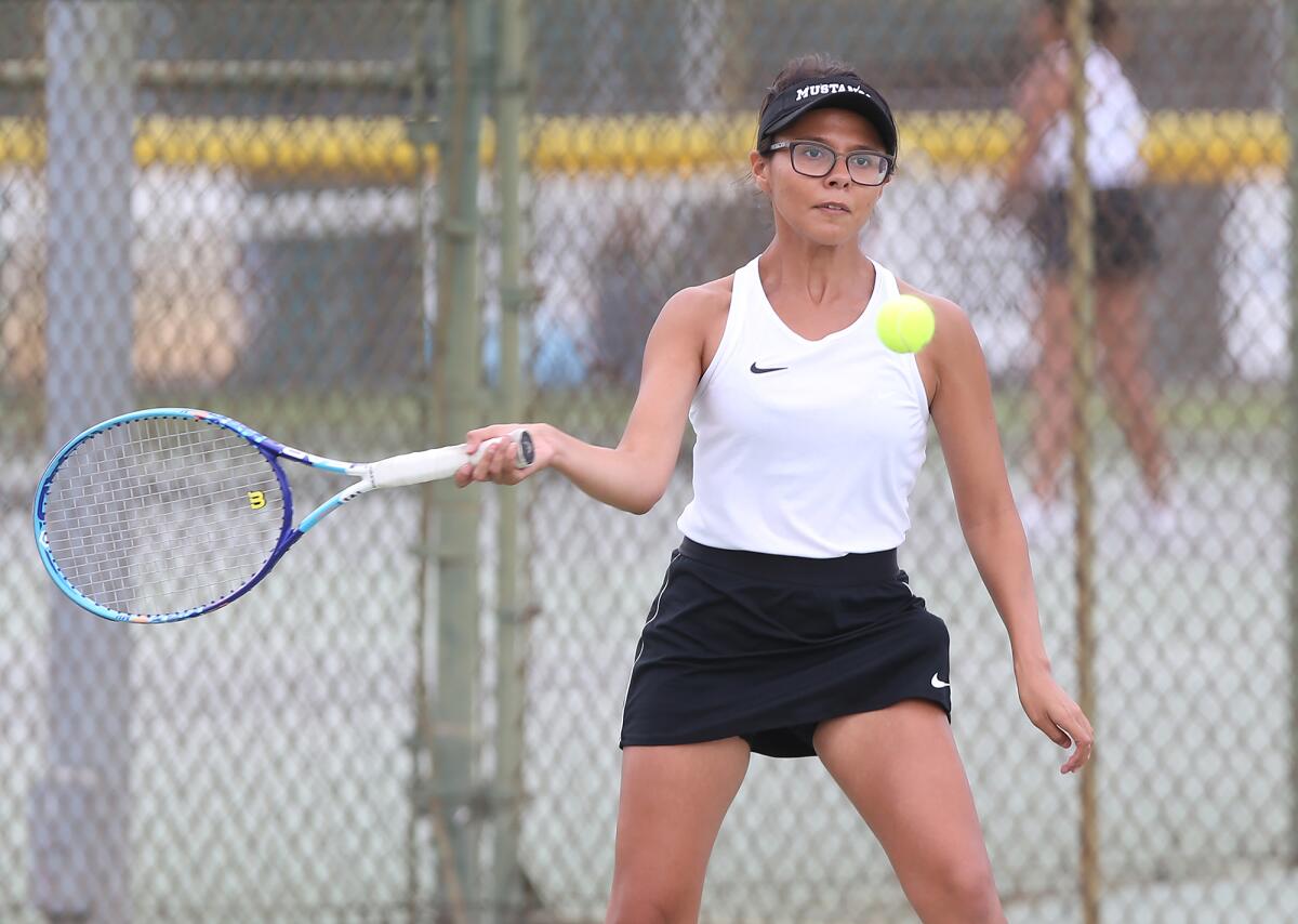 Leslie Delgado hits a forehand in Costa Mesa's Orange Coast League home match against rival Estancia on Thursday.