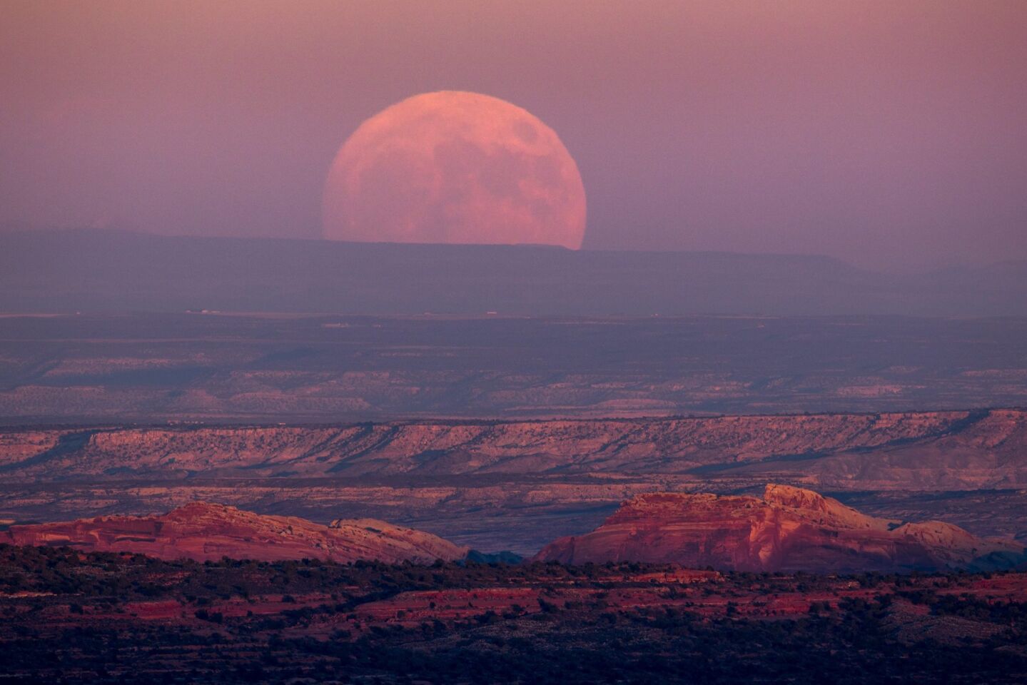 A nearly full moon rises above the Valley of the Gods near Mexican Hat, Utah. November will see the largest full moon since 1948, also known as the 'supermoon,' when the moon reaches its closest point to Earth.