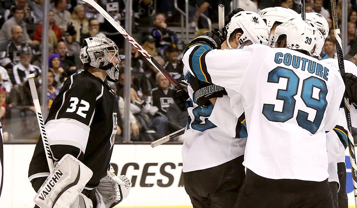 San Jose Sharks players had plenty to celebrate against goaltender Jonathan Quick (32) and the Kings, who came back from a 3-0 deficit to win the first-round playoff series in a seventh game in San Jose.