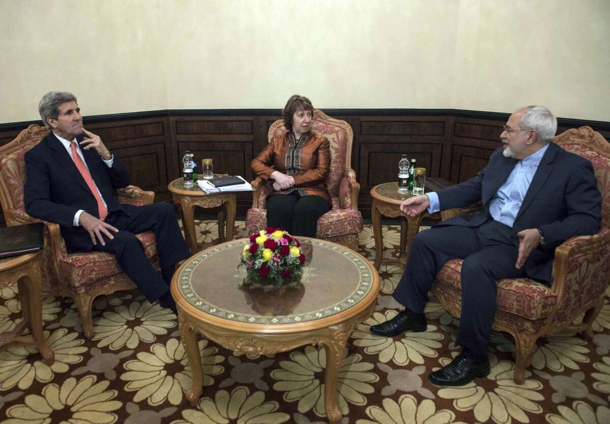 U.S. Secretary of State John F. Kerry, left, European Union envoy Catherine Ashton and Iranian Foreign Minister Javad Zarif meet in Muscat, Oman, on Nov. 10.