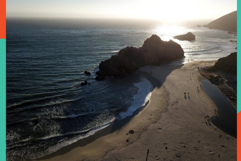 BIG SUR, CALIF. -- THURSDAY, AUGUST 2, 2018: The sun sets behind Keyhole Arch at Pfeiffer Beach on the Big Sur coast along Highway One in Big Sur, Calif., on Aug. 2, 2018. For a few weeks in the winter, the string sun casts a glow through a 'keyhole' in the arch.