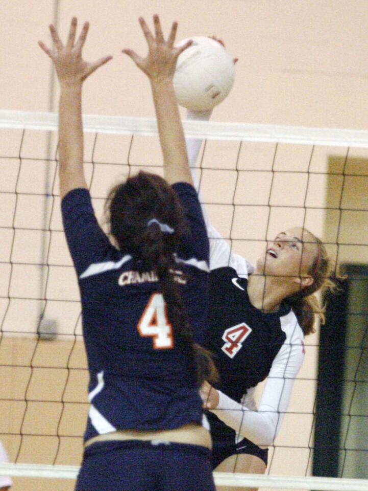 FSHA's Maddie Peterson, right, blocks a spike from Chaminade's Rio Morigi during a game at Flintridge Sacred Heart Academy in La Canada on Thursday, October 11, 2012.