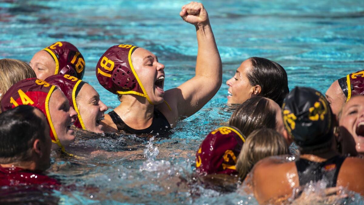 USC's Kaylee Brownsberger (18) celebrates with teammates after defeating Stanford for the NCAA title on Sunday.