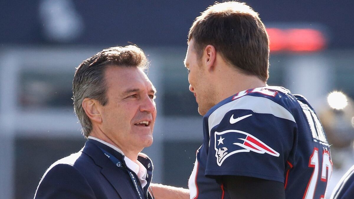 Neal ElAttrache, left, team physician for the Rams, operated on the left knee of New England Patriots quarterback Tom Brady, right, in 2008 and the two have been close friends since.