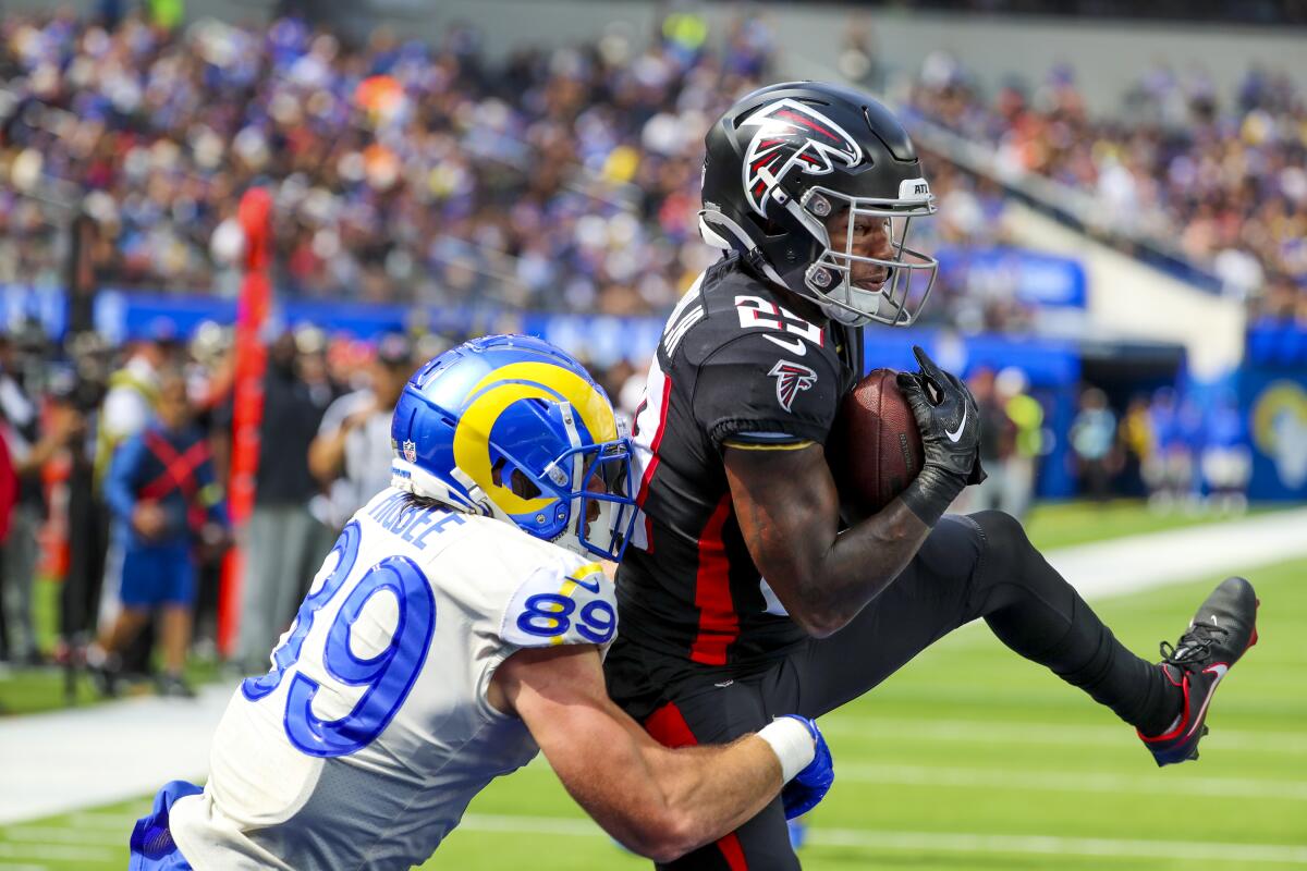 Falcons cornerback Casey Hayward intercepts a pass in the end zone intended for Rams tight end Tyler Higbee.