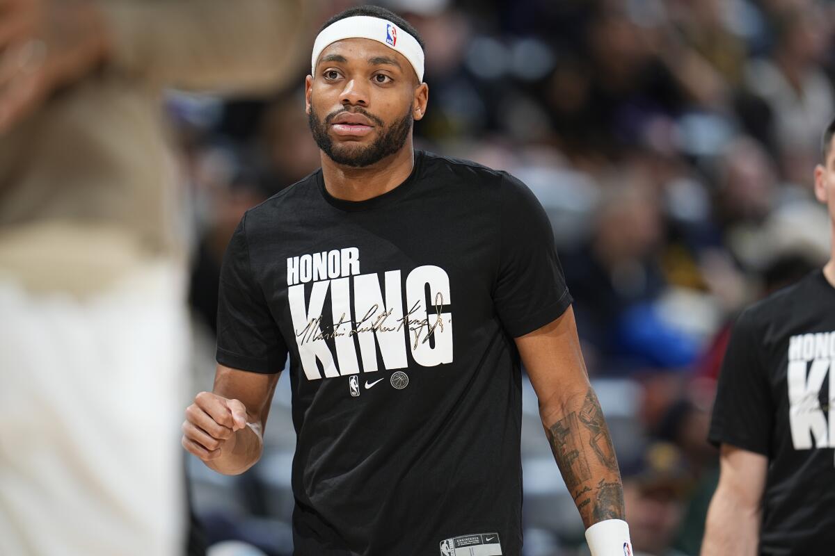 Forward Bruce Brown wears a Martin Luther King T-shirt during a game.
