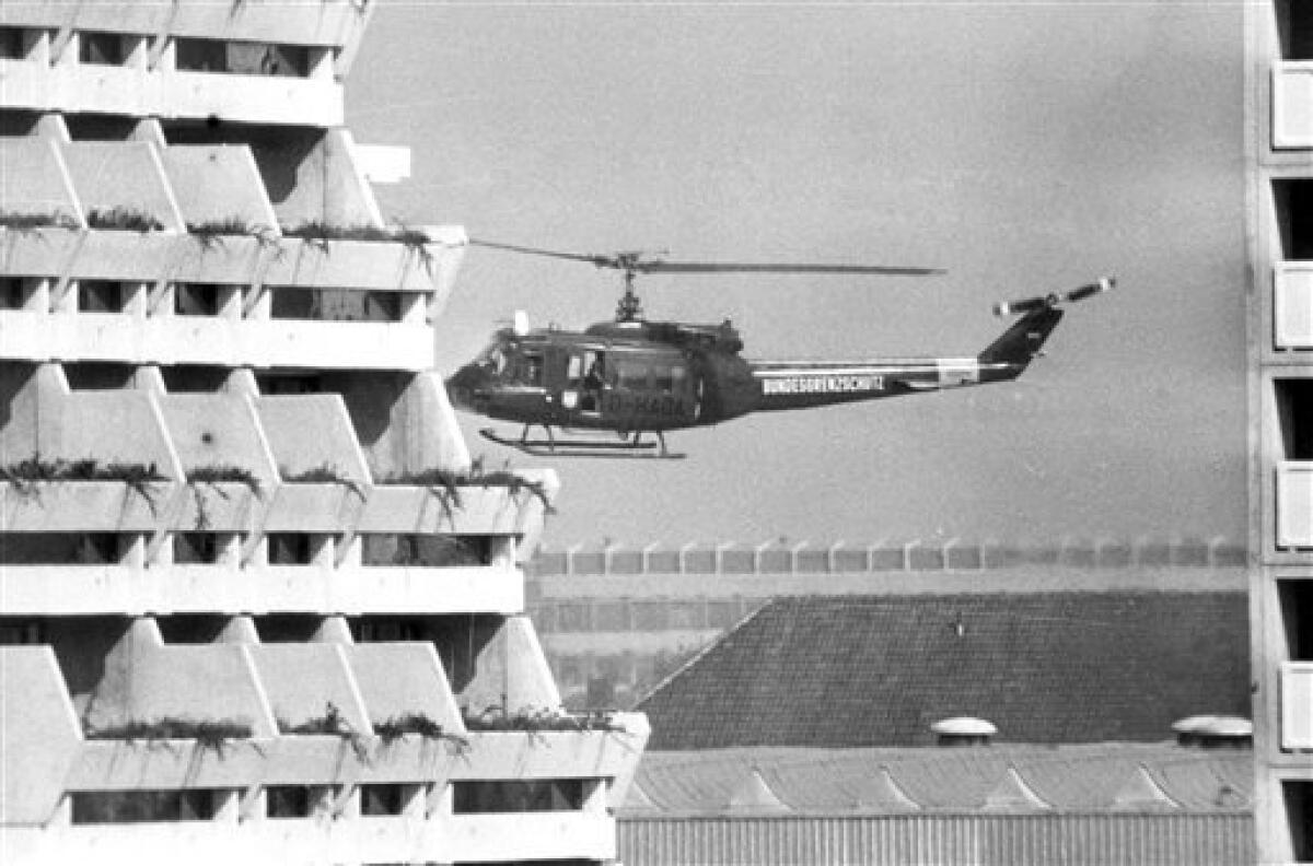 FILE - In this Sept. 5, 1972 file photo, a West German border police helicopter is about to land at the Olympic Village in Munich, after terrorists held 13 Israelis hostage inside the village. The helicopter is reported to be ready to fly the terrorists to Munich airport if the West German goverment agrees to the demands of the terrorists. (AP Photo/File)