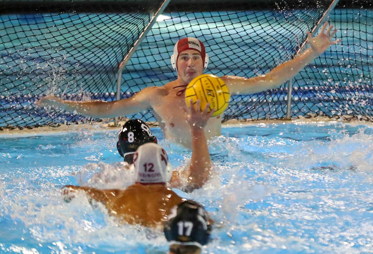 Laguna Beach goalie Tyler Swensen (1) stops a shot by Foothill's William Griswold (8) during Wednesday's match. 