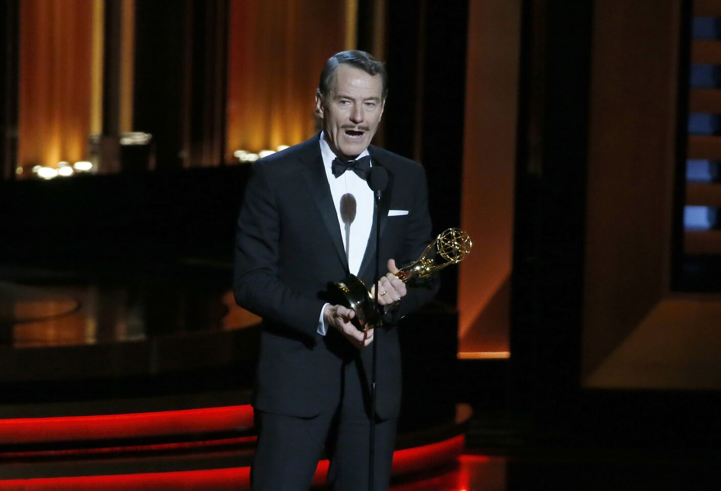 Bryan Cranston of "Breaking Bad" wins the lead actor in a drama, his fifth Emmy win. "I love to act, it is a passion of mine and I will do it until my last breath," Cranston says. He dedicates the award to all the "Sneaky Petes," a nickname his family gave him because of his manipulative ways as a young child.