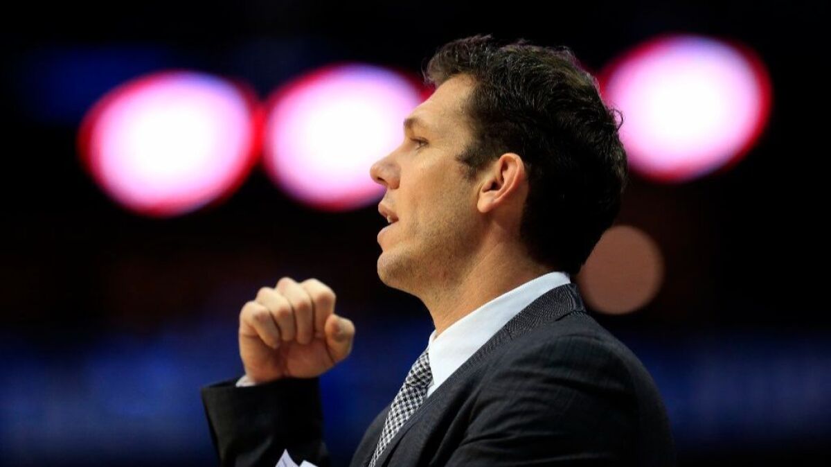 Lakers Coach Luke Walton works from the bench during his team's 122-73 loss to the Mavericks in Dallas on Jan. 22.