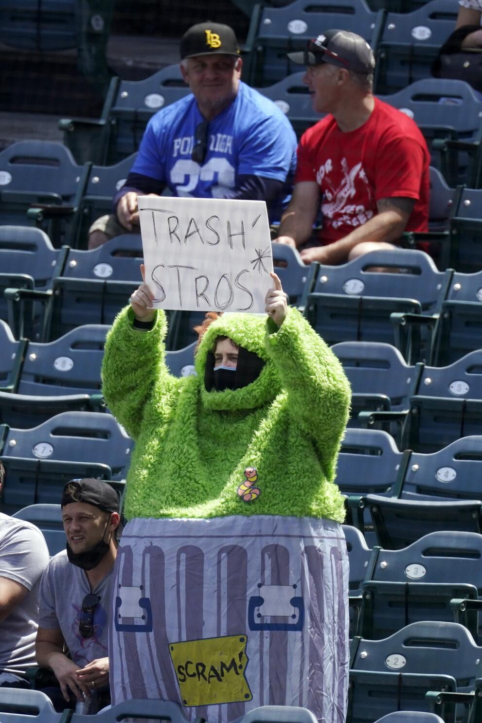 Baseballer - A fan threw an inflatable trash can onto the