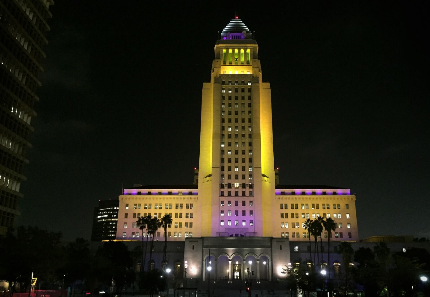 Los Angeles City Hall is decorated with Lakers' purple and gold lights for Kobe Bryant's last game.