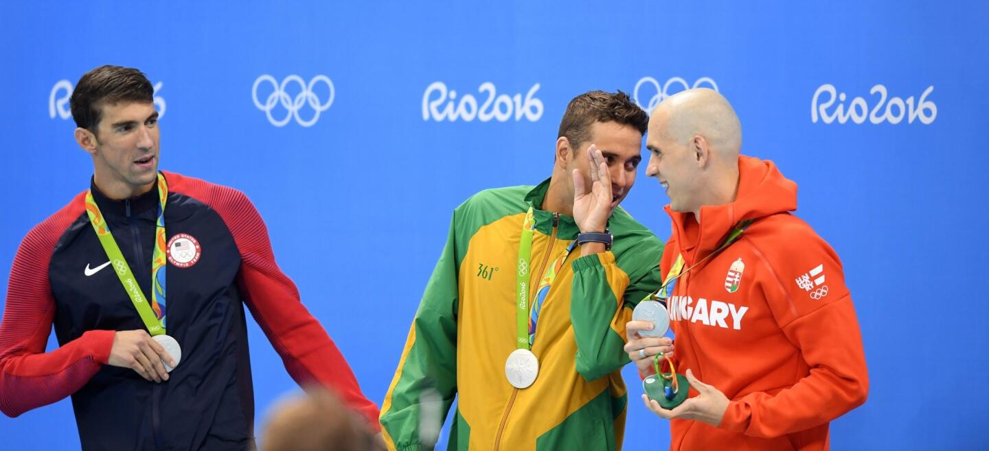 Joint silver medalists Michael Phelps of USA (L-R), Chad Guy Bertrand Le Clos of South Africa and Laszlo Cseh of Hungary pose durign the medal ceremony for men's 100m Butterfly Final race of the Rio 2016 Olympic Games Swimming events at Olympic Aquatics Stadium at the Olympic Park in Rio de Janeiro, Brazil.