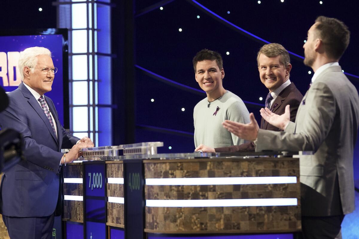 Host Alex Trebek chats with the contestants during the 'Jeopardy! Greatest of All Time' tournament.