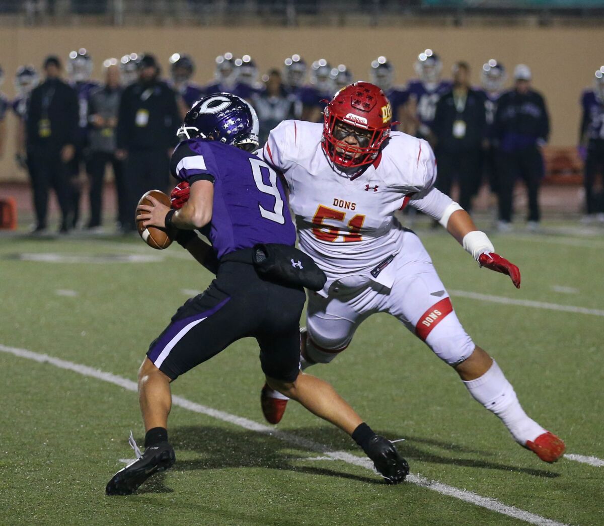 Cathedral's Jaxson Moi prepares to sack Julian Sayin of Carlsbad in last week's Open Division championship game.