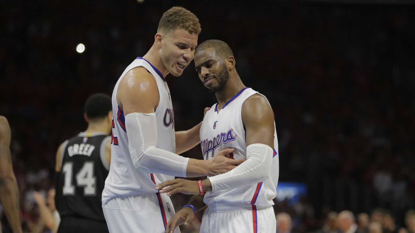 Clippers forward Blake Griffin, left, and point guard Chris Paul celebrate during the closing seconds of a 111-109 win over the San Antonio Spurs in Game 7 of the Western Conference quarterfinals on May 2, 2015.