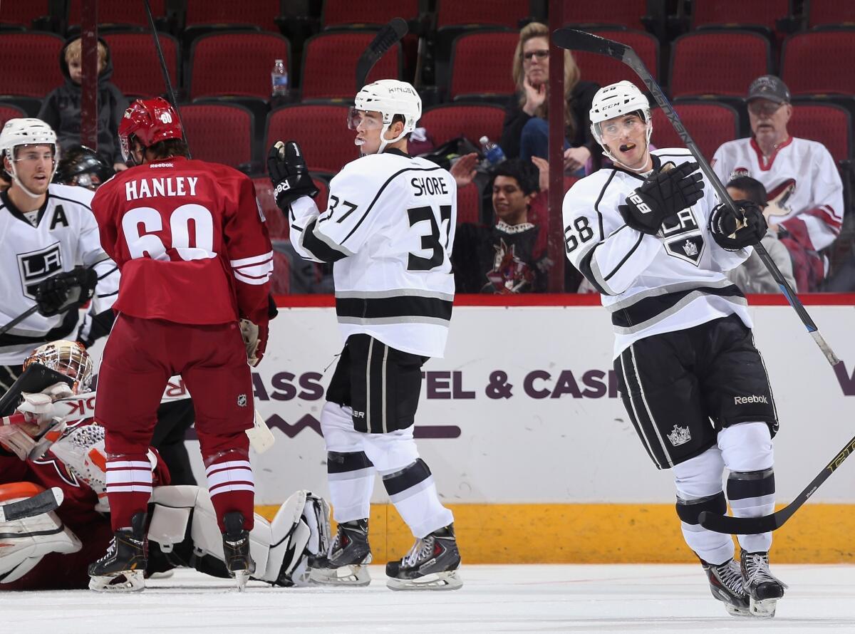 Kings second-round draft pick Roland McKeown, right, celebrates after scoring a goal against the Arizona Coyotes on Sept. 16. McKeown has been returned to Kingston of the Ontario Hockey League as part of the Kings' first cuts of training camp.