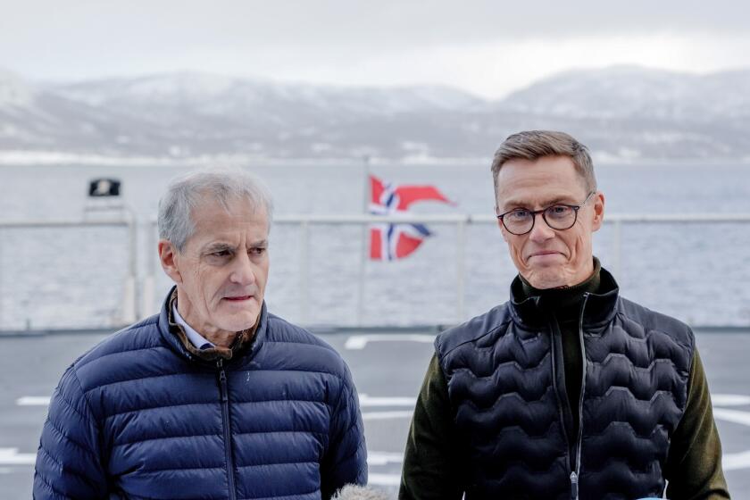 FILE - Norwegian Prime Minister Jonas Gahr Støre, left, and Finnish President Alexander Stubb stand on board the Norwegian ship KV Bjørnøya, in connection with the NATO military exercise Nordic Response, outside Alta, Norway, on March 7, 2024. The Norwegian center-left governnment wants “a historic increase” in defence spending with 600 billion kroner ($56 billion) over the next 12 years. Prime Minister Jonas Gahr Støre said Friday that “we need a defence that is fit for purpose in the emerging security environment” and noted that “our security environment is deteriorating.” (Heiko Junge/NTB Scanpix via AP, File )