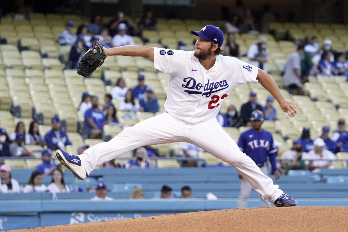Dodgers starting pitcher Clayton Kershaw delivers against the Texas Rangers on June 11.