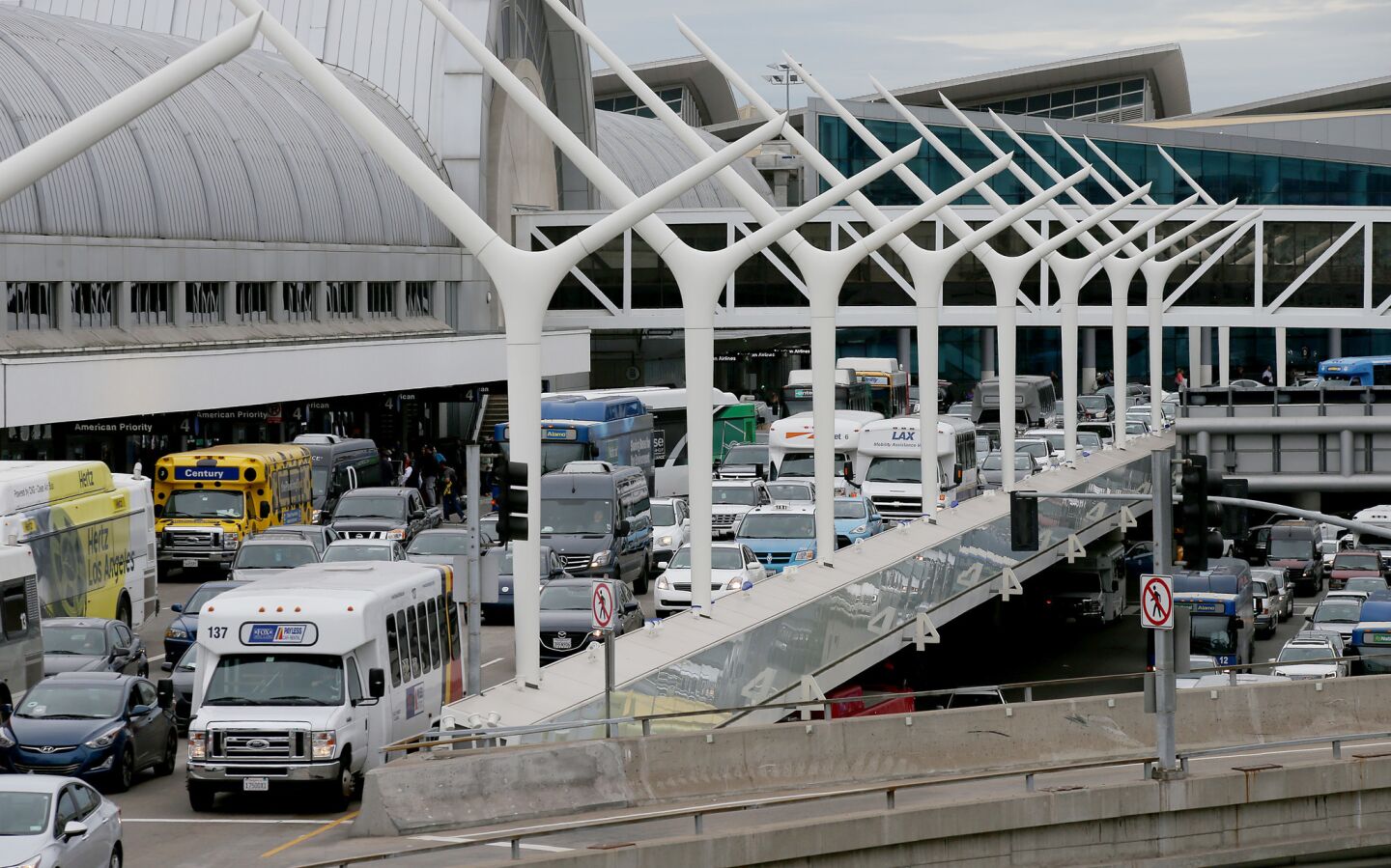 Traffic outside Terminal 5 at LAX backs up after unattended baggage was found in a restroom on Wednesday.
