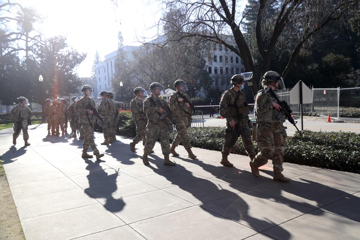 National Guardsmen patrol the area near the California State Capitol in Sacramento.