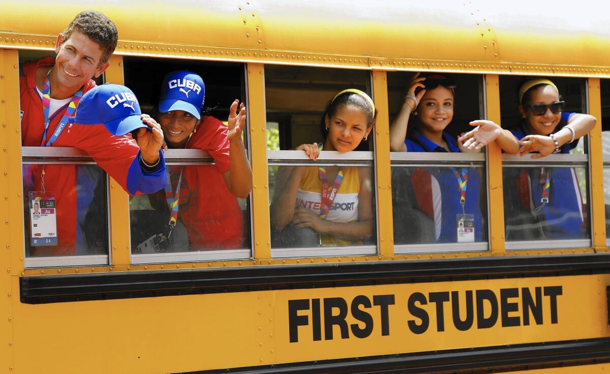 Members of the Cuban delegation to the Special Olympics leave Harvard-Westlake School in Studio City after practice on Wednesday.