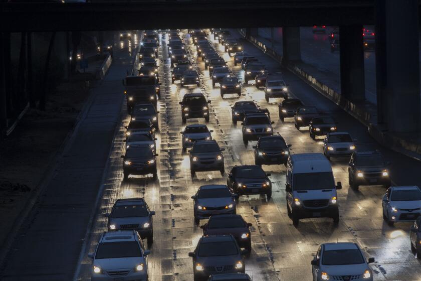 National City, CA. JAN 09, 2018- Traffic moved slowly on Interstate 5 through downtown early Tuesday as motorists drove cautiously in the rain. PHOTO/JOHN GIBBINS, Staff photographer, San Diego Union-Tribune) copyright 2018