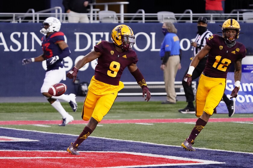 Arizona State's D.J. Taylor (9) scores a touchdown against Arizona on a kick return during the first half of an NCAA college football game Friday, Dec. 11, 2020, in Tucson, Ariz. (AP Photo/Rick Scuteri)