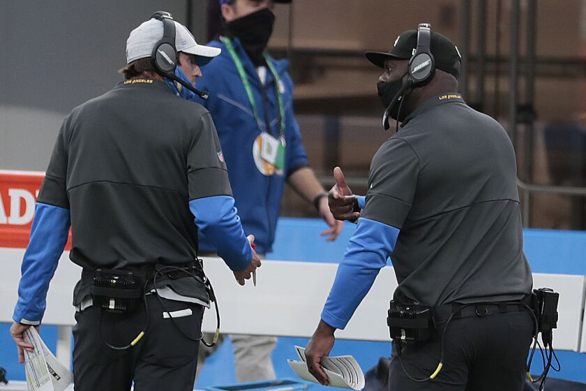 Inglewood, CA, Sunday, Dec. 13, 2020 Chargers coach Anthony Lynn, right, has a heated discussion.