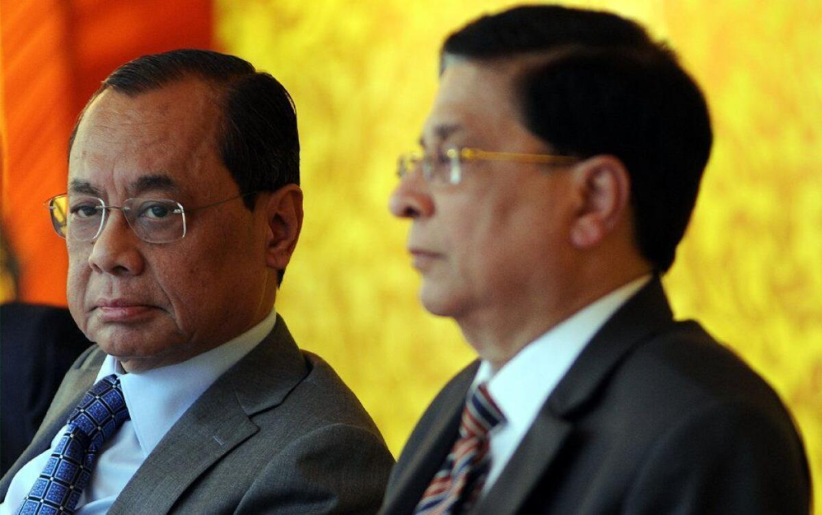 Dipak Misra, at right, attends a farewell event to mark the end of his tenure as chief justice of the Indian Supreme Court, alongside his successor Ranjan Gogoi.
