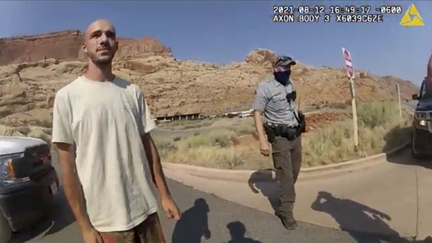 FILE - This Aug. 12, 2021, file photo from video provided by the Moab, Utah, Police Department shows Brian Laundrie talking to a police officer after police pulled over the van he was traveling in with his girlfriend, Gabrielle "Gabby" Petito, near the entrance to Arches National Park in Utah. Laundrie, the boyfriend of slain cross-country traveler Gabby Petito, took responsibility for killing her in a notebook discovered near his body in a Florida swamp, the FBI announced Friday, Jan. 21, 2022. (The Moab Police Department via AP, File)