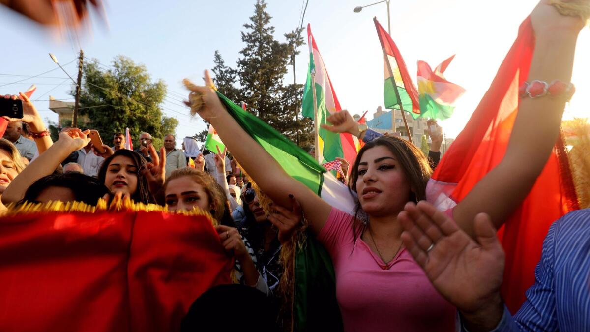 Syrian Kurds demonstrate in the northeastern Syrian city of Qamishli on Oct. 23, 2017, against Iraqi forces operating in the multiethnic city of Kirkuk.