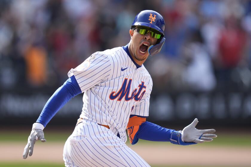 New York Mets' Mark Vientos celebrates after hitting a walkoff home run during the 11th inning of a baseball game against the St. Louis Cardinals at Citi Field, Sunday, April 28, 2024, in New York. (AP Photo/Seth Wenig)