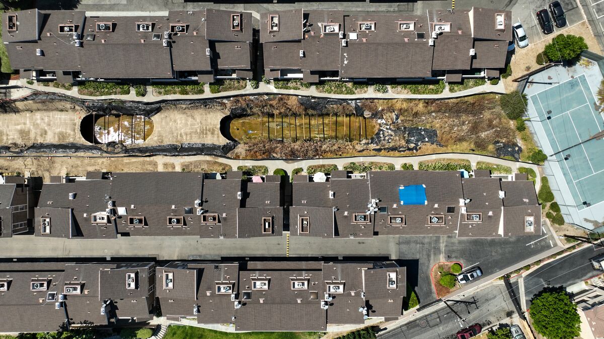 An aerial view of the exposed flood channel that bifurcates the Coyote Village condo complex.