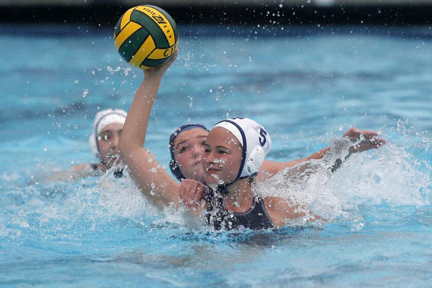 Flintridge Prep's Isabel Simons (5) competes against Marina during the first half in the CIF Southern Section Division VI championship match at Woollett Aquatics Center in Irvine on Saturday.