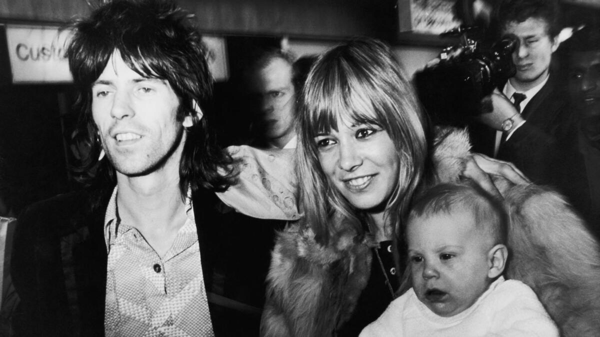 Rolling Stones guitarist Keith Richards is reunited with girlfriend with Anita Pallenberg and their son, Marlon on his arrival at London Airport (now Heathrow) from the U.S. on Dec. 8, 1969.