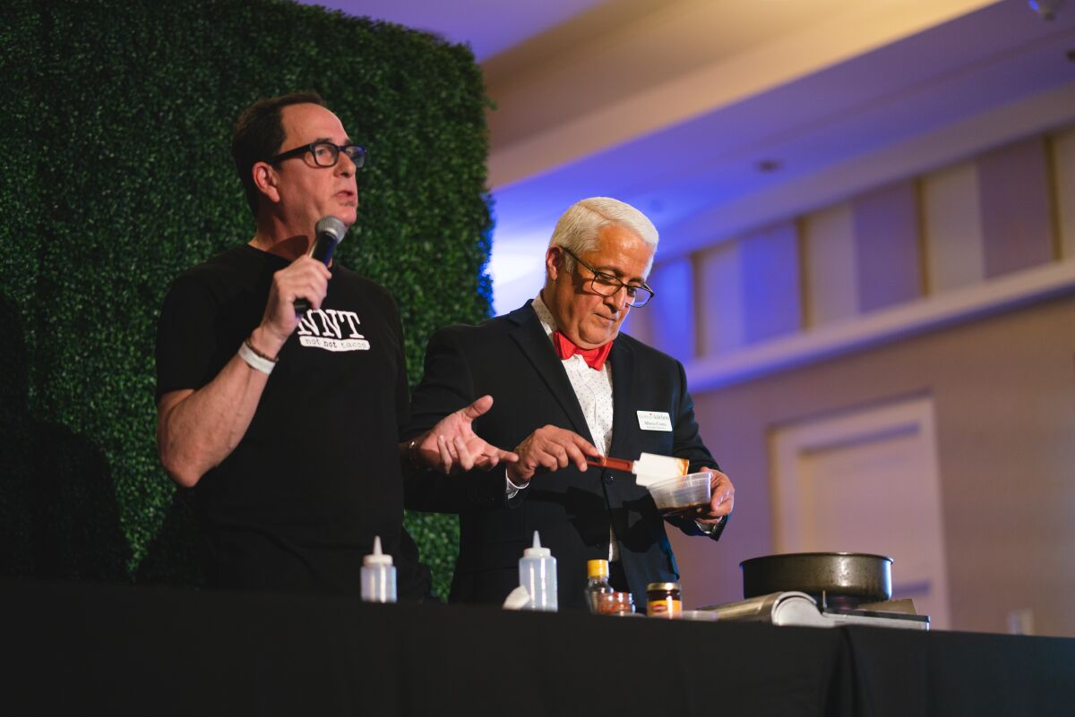 Host Sam "The Cooking Guy" Zien and Mama's Kitchen CEO Alberto Cortés at the 2018 Mama's Day event.