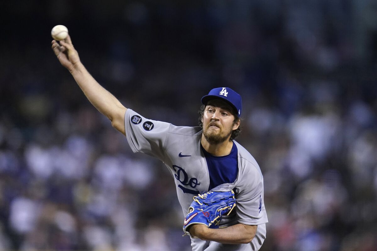 Los Angeles Dodgers starting pitcher Trevor Bauer releases a pitch