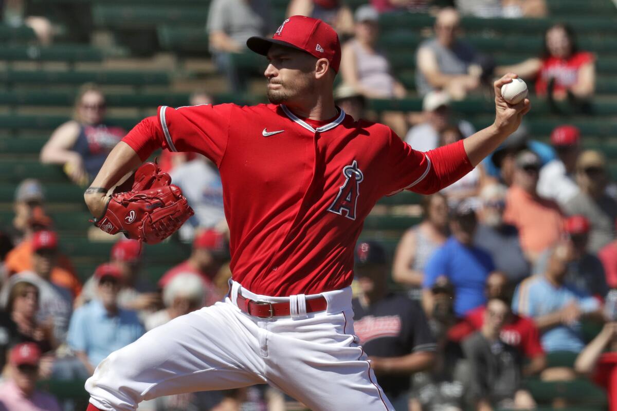 Angels pitcher Andrew Heaney throws during the first inning of a spring training game against the Cleveland Indians.