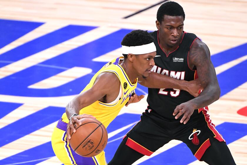 ORLANDO, FLORIDA SEPTEMBER 30, 2020-Lakers Rajopn Rondo dribbles past a Heat.