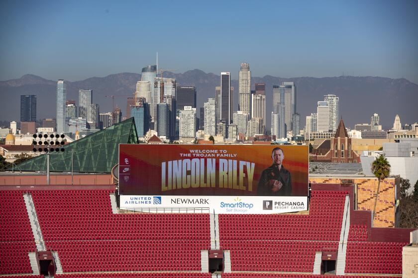LOS ANGELES, CA - November 29 2021: A giant video board at the Coliseum features Lincoln Riley who will be announced as the new head football coach at USC during a press conference at the Coliseum on Monday, Nov. 29, 2021 in Los Angeles, CA. (Brian van der Brug / Los Angeles Times