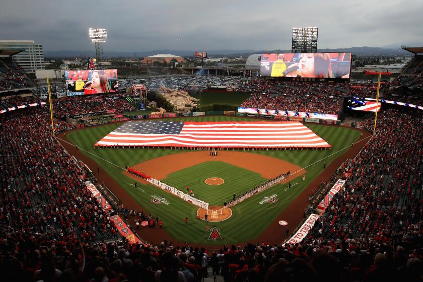 A large American flag is unfurled during introductions of the Los Angeles Angels of Anaheim and the Cleveland Indians prior to the Los Angeles Angels of Anaheim home opening game at Angel Stadium on April 2, 2018 in Anaheim, California. (Photo by Sean M. Haffey/Getty Images)