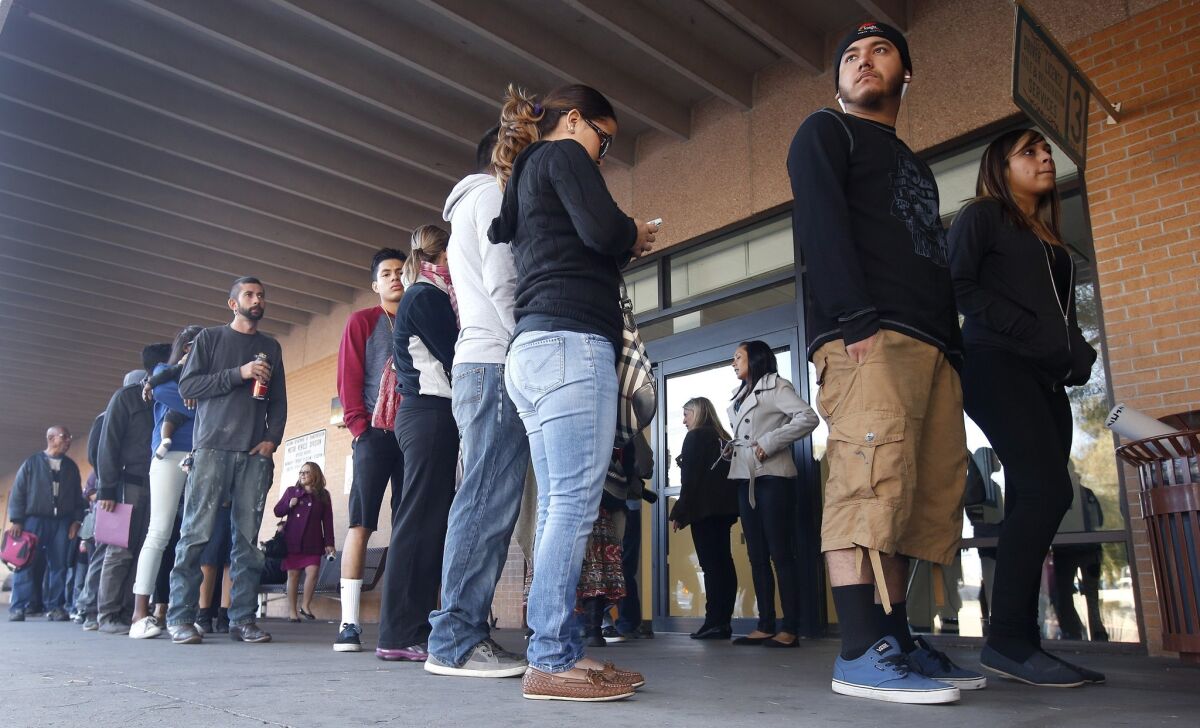 Last December, lines stretched outside Arizona Department of Motor Vehicles offices, including this one in Phoenix. That was the first day immigrants protected from deportation under new Obama administration policies could pursue Arizona driver's licenses.